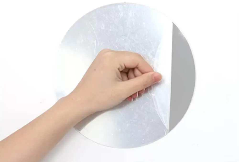Acrylic Mirror Sheet Protective Film Removal Removing the protective film from an acrylic mirror sheet